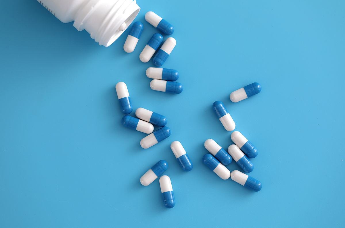 Glucosamine Capsules on a blue background