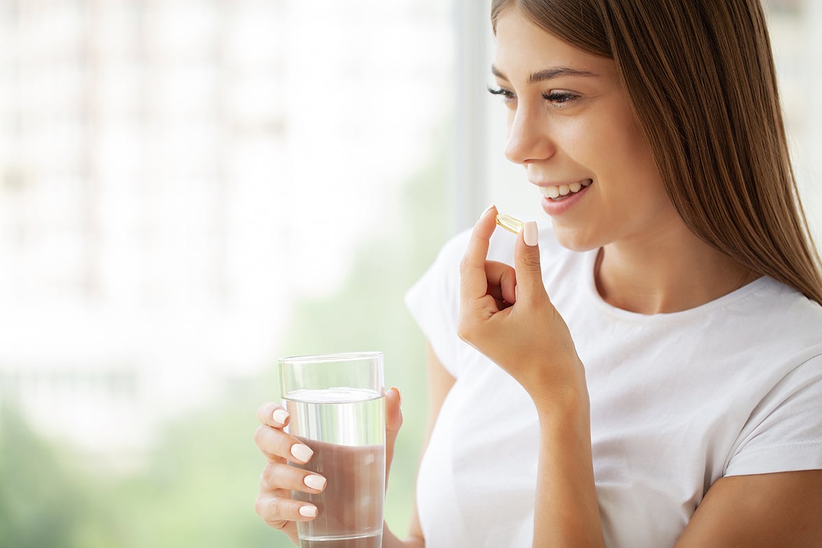 Woman taking fish oil