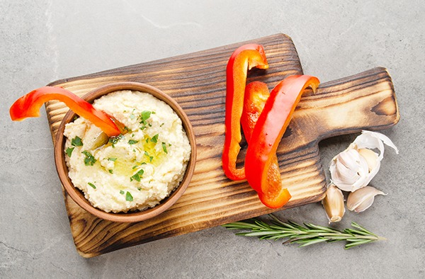 Healthy snack of red peppers and hummus