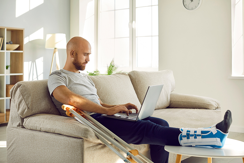 A man wearing a cast on his broken