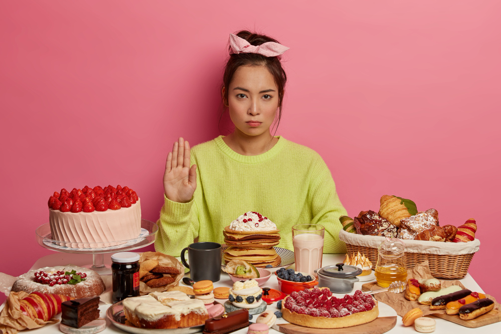 woman refusing dessert to cut back on sugar