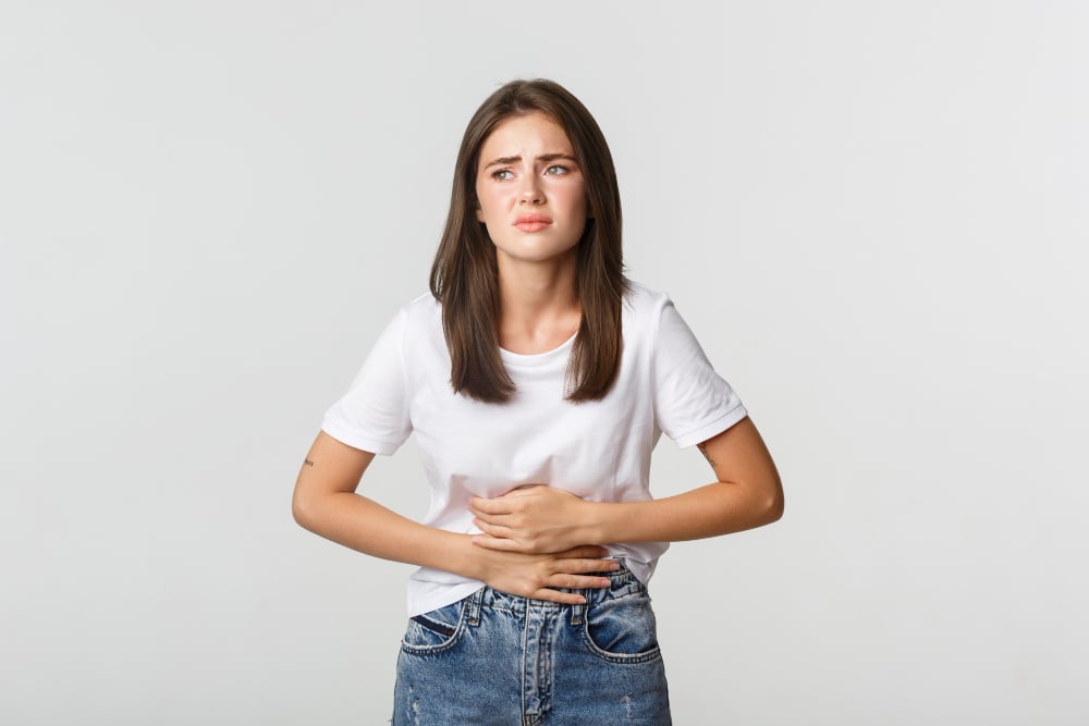 Woman with stomach gut discomfort