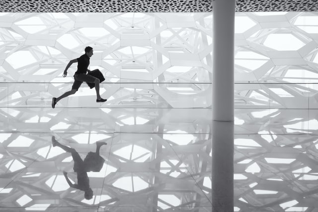 Person running through a hallway