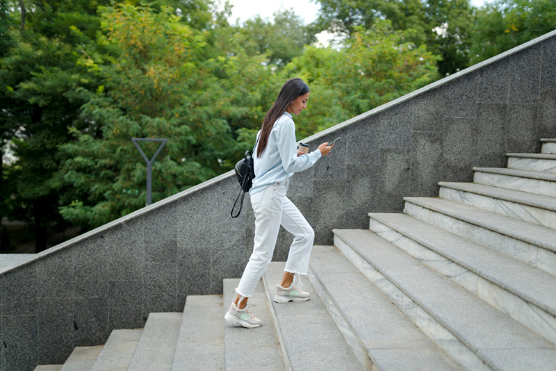 woman walking up stairs