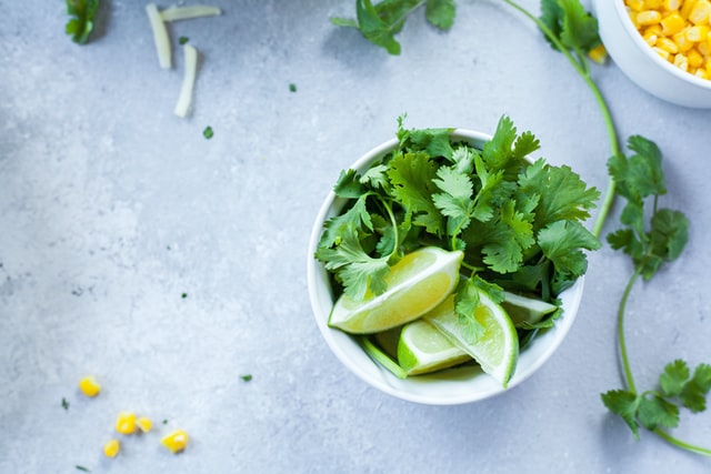 A bowl of lime and cilantro