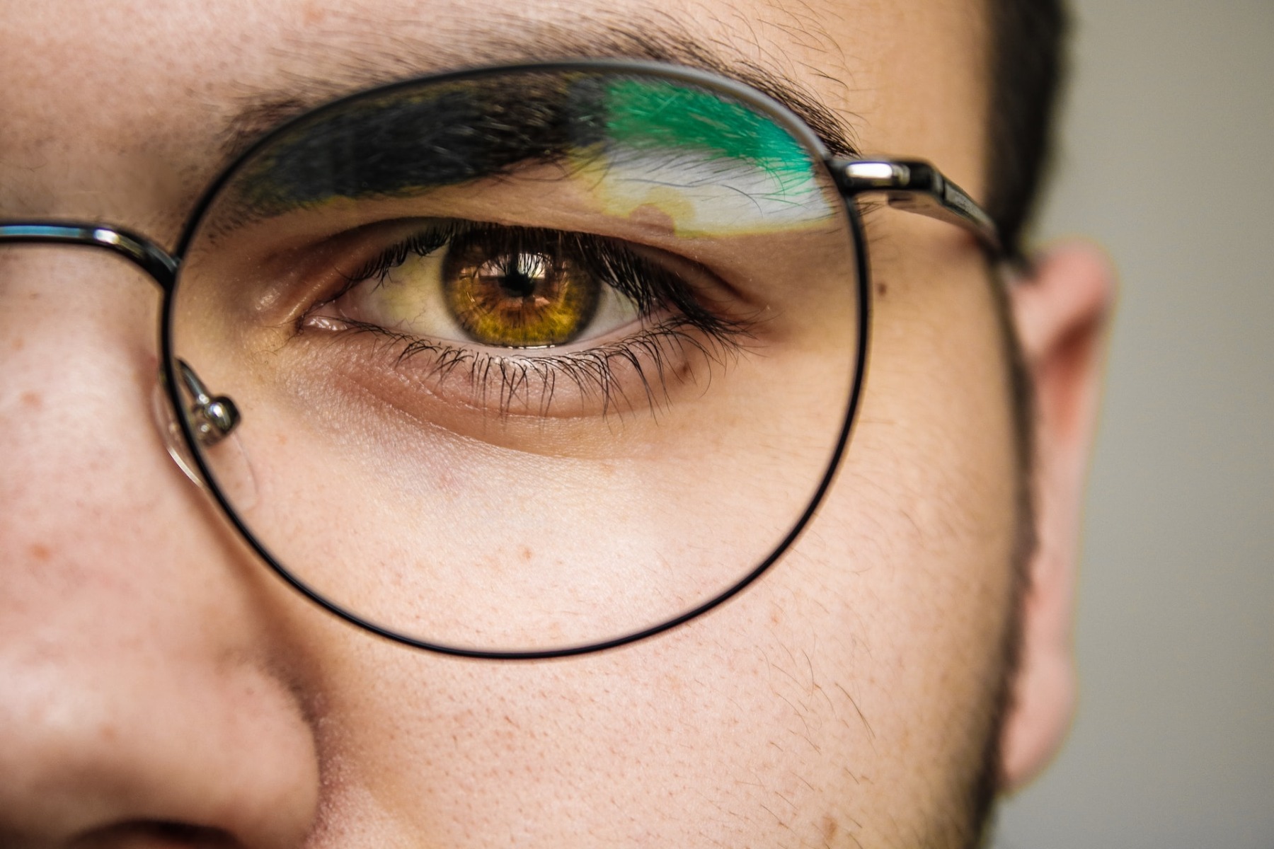 Man wearing glasses looking at the viewer