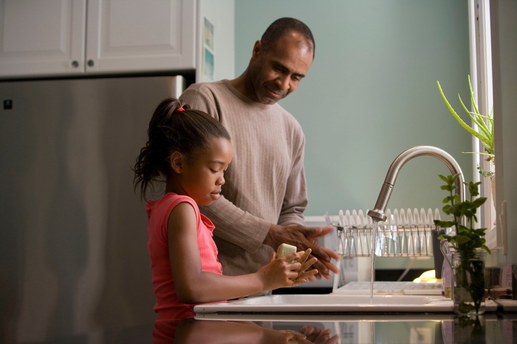 Ways to Destress: Father an Daughter doing dishes
